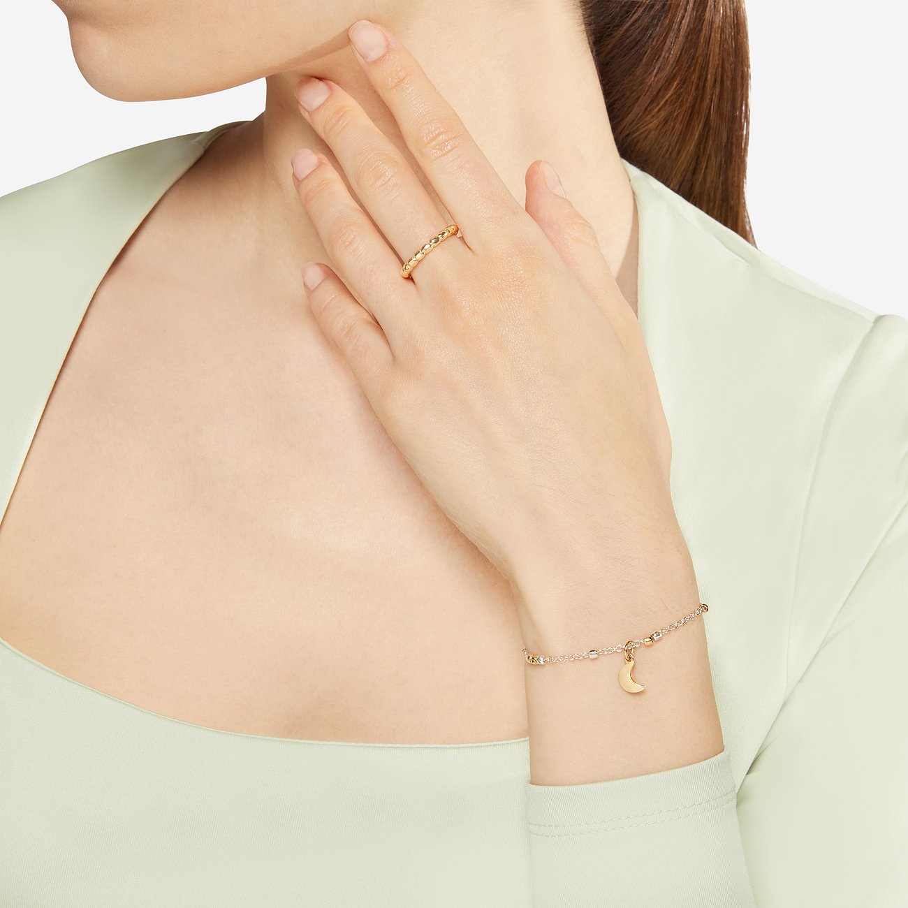 DoDo Armband aus 925er Silber und 750er Gelbgold mit Mond-Anhänger.