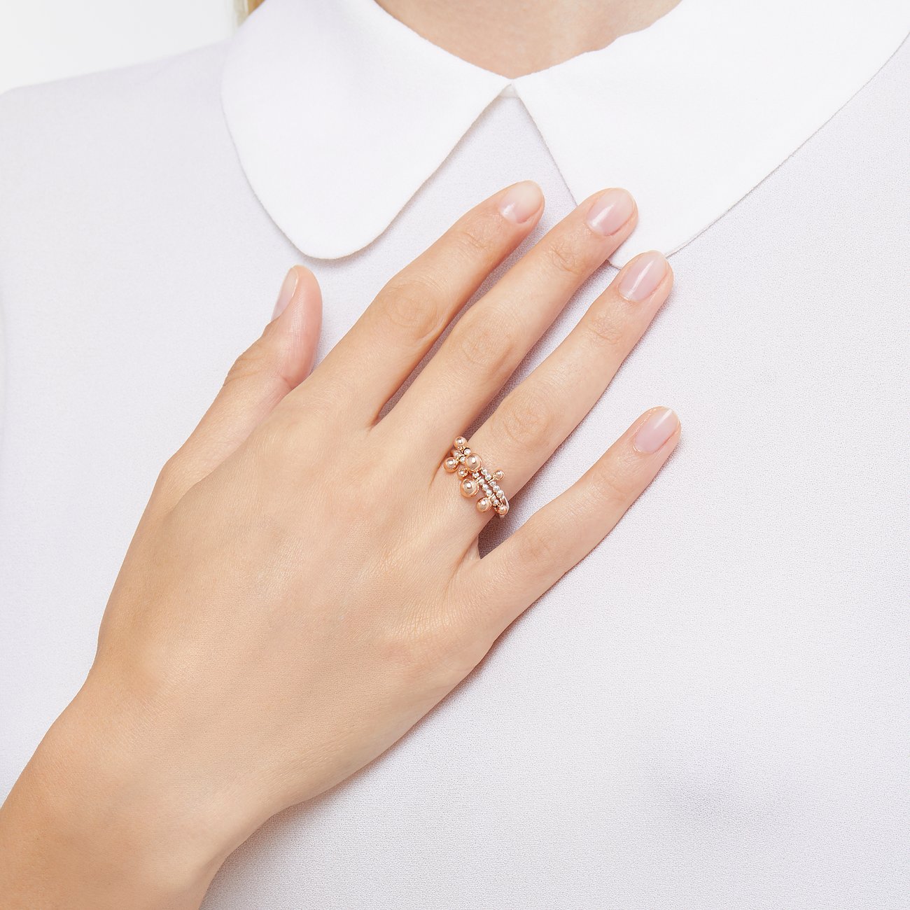 DoDo Ring aus 375 Roségold und 925 Silber mit Steinen.