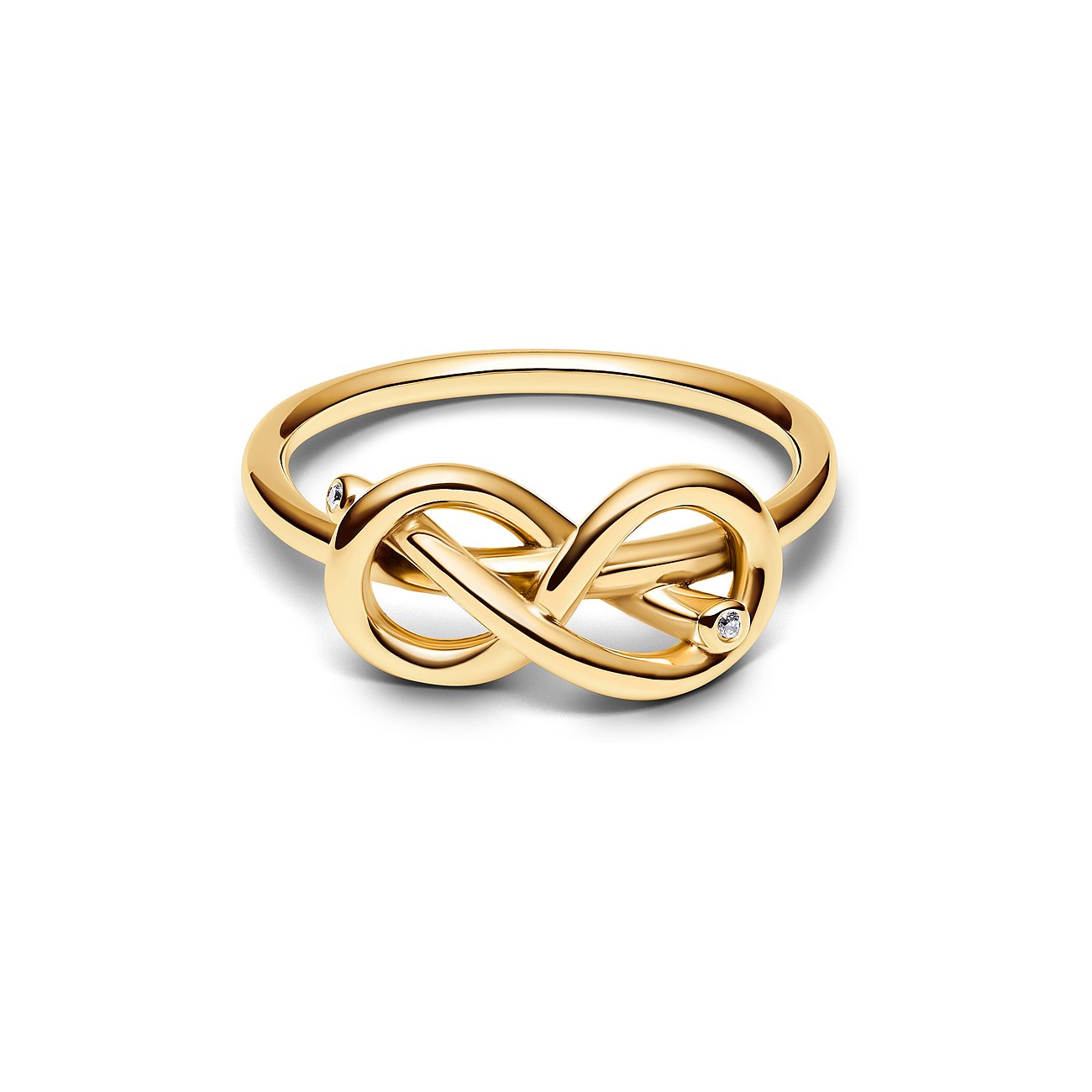 Pandora Ring aus gelbgoldenem Metall mit Unendlichkeitsknoten und zwei glitzernden Zirkonia-Steinen.