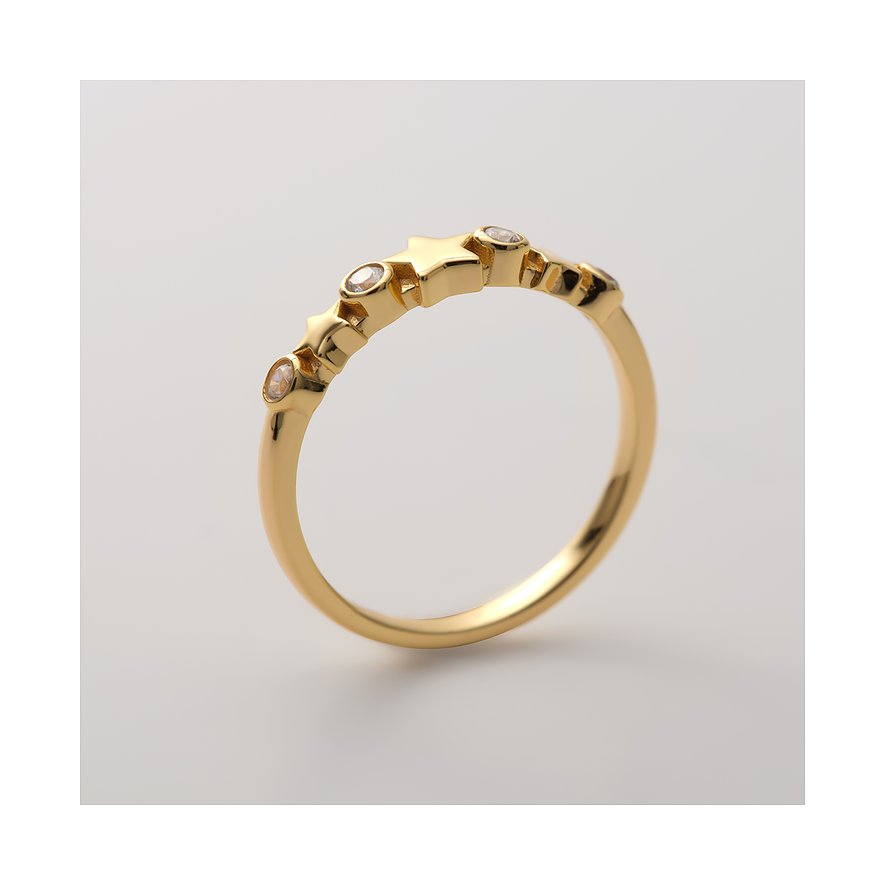 CHRIST ring i förgyllt återvunnet silver med stjärnmönster och klara zirkoniastenar, snett uppifrån.