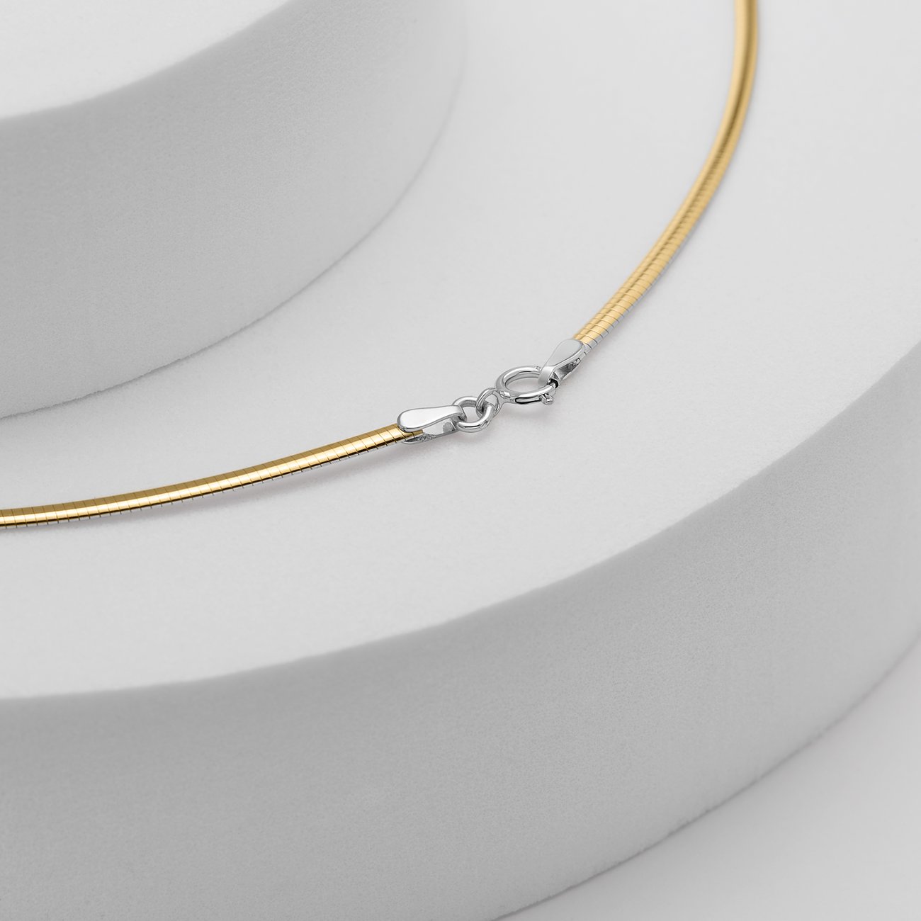 CHRIST Kette aus 585 Gelb- und Weißgold, als Schlangenkette.