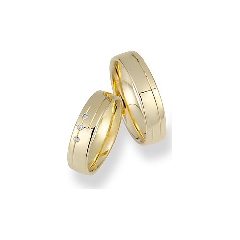 CHRIST Trauringe aus Gelbgold mit drei Brillanten.