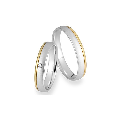 CHRIST Trauringe aus 925er Silber mit Gelbgold und einem Stein.