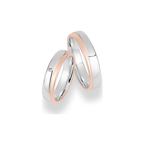 CHRIST Trauringe aus Weißgold und Roségold mit einem Diamanten.