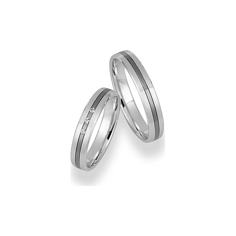 CHRIST Trauringe aus konfiguriertem Material mit drei Diamanten.