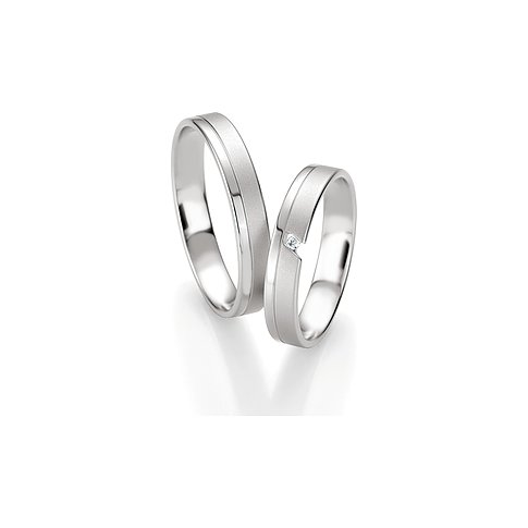 CHRIST Trauringe aus konfiguriertem Material mit einem Stein.