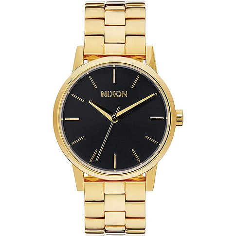 Eine Nixon Damenuhr mit goldenem Gehäuse und Armband sowie einem schwarzen Zifferblatt.