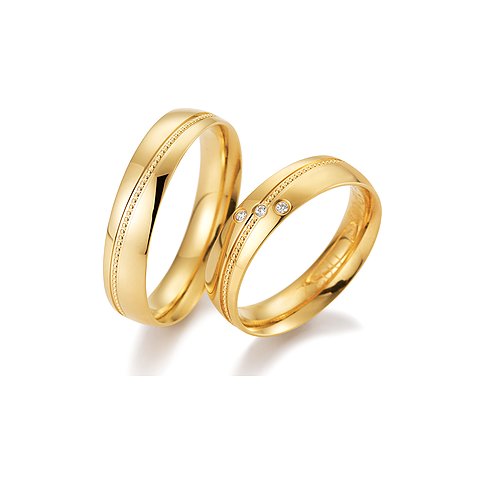 CHRIST Trauringe aus Gelbgold mit drei Brillanten und Perlrand.