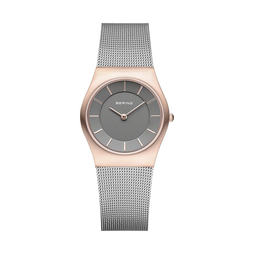 Bering Damenuhr aus poliertem roségoldfarbenem Edelstahl mit silberfarbenem Milanaise-Armband und grauem Zifferblatt.