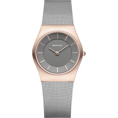 Bering Damenuhr aus poliertem roségoldfarbenem Edelstahl mit silberfarbenem Milanaise-Armband und grauem Zifferblatt.