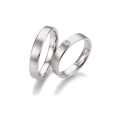 CHRIST Trauringe aus Palladium, mattiert, mit einem Stein.