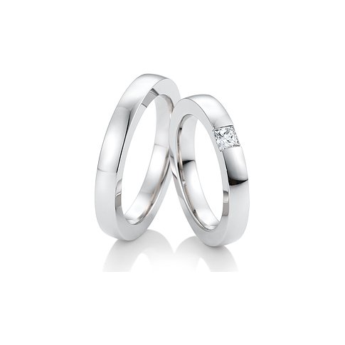 CHRIST Trauringe aus Weißgold mit einem Prinzess-Schliff-Stein.
