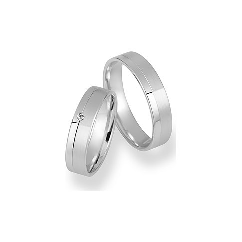 CHRIST Trauringe aus Weißgold mit einem Stein.