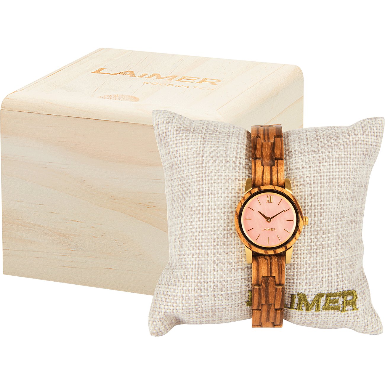 Laimer damklocka i mörkbrunt trä på en beige kudde, bredvid en ljus trälåda.