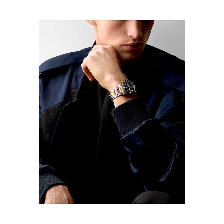 Longines Herrenuhr mit Edelstahlgehäuse, Keramiklünette und bicolor-Armband.