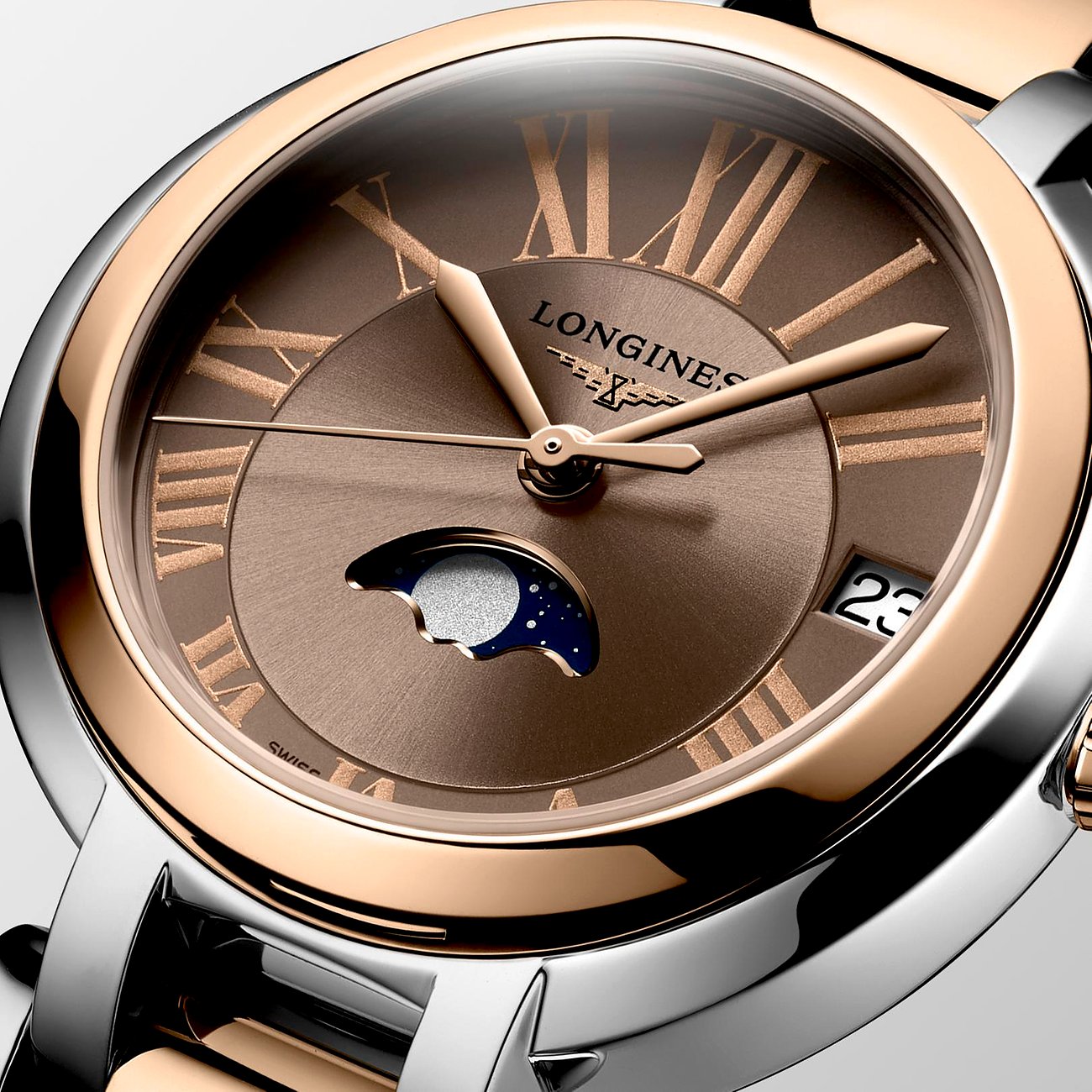 Longines Damenuhr mit Edelstahlgehäuse und Roségold-Lünette, analog, mit Mondphase.