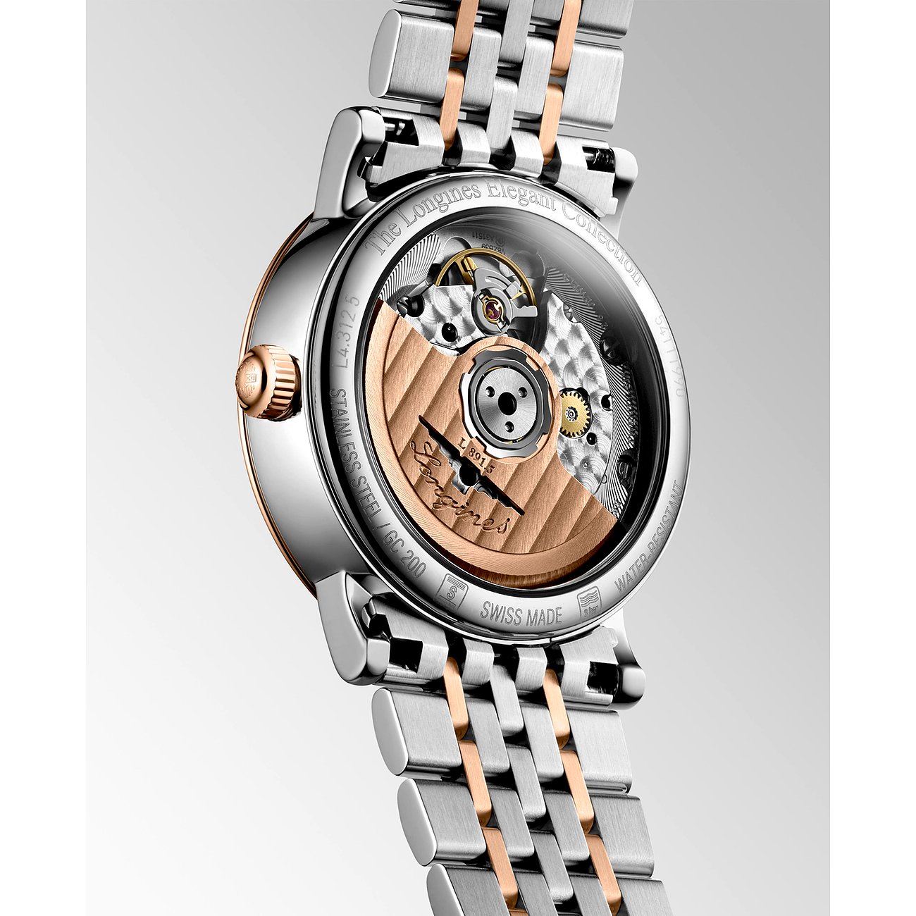Rückseite einer Longines Damenuhr aus Edelstahl und Roségold mit Sichtboden, der das Uhrwerk zeigt.