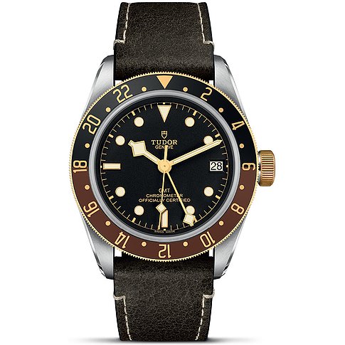 Tudor Herrenuhr mit Edelstahlgehäuse und Gelbgoldlünette, schwarzes Zifferblatt, analog.