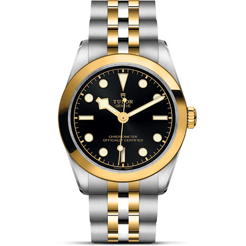 Tudor Damenuhr mit Edelstahlgehäuse und Gelbgold, analog, schwarzes Zifferblatt.