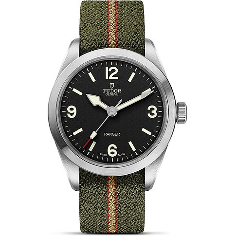 Tudor Unisexuhr mit Edelstahlgehäuse, schwarzem Zifferblatt und grünem Textilarmband.