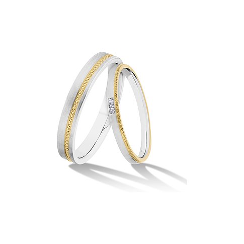 CHRIST Trauringe aus Gelbgold und Silber mit drei Diamanten.