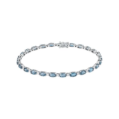 CHRIST 750 Weißgold Armband im Tennis-Stil, besetzt mit ovalen blauen Topasen und kleinen runden klaren Steinen.
