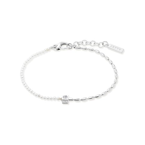 JETTE 925er Silber Armband mit kleinen Perlen und Zirkonia Steinen, horizontal liegend mit Verschluss.