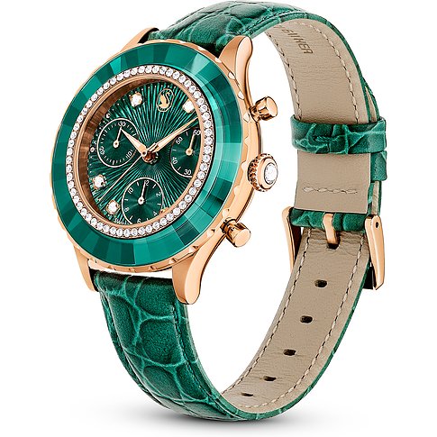 Swarovski dameshorloge met roségoudkleurige kast, groene lunette en kristallen versiering.