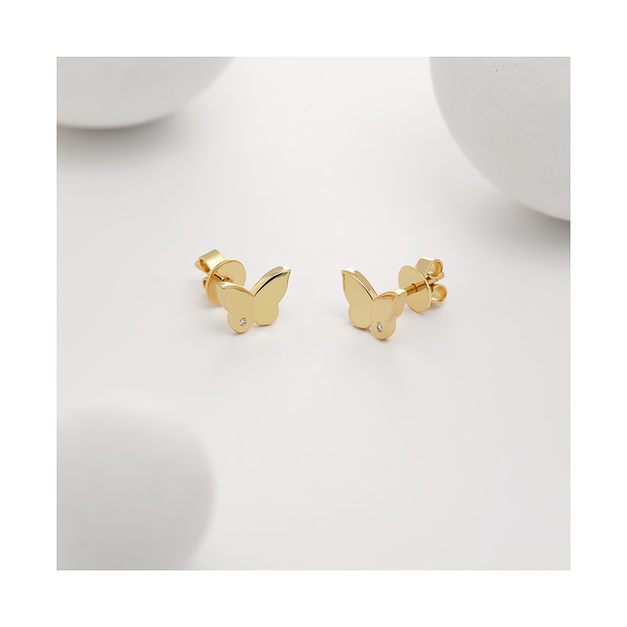 Ein Paar Schmetterlingsohrstecker von Guido Maria Kretschmer aus goldenem Silber, verziert mit einem kleinen Diamanten.