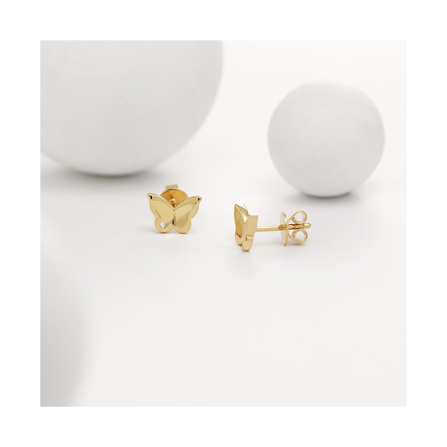 Guido Maria Kretschmer Ohrstecker in Schmetterlingsform aus goldfarbenem Silber mit einem Diamant.