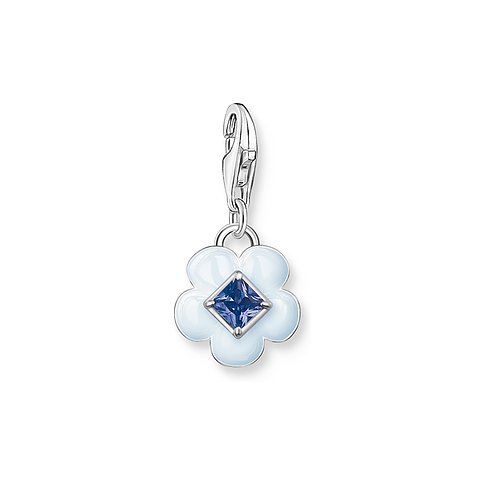 Thomas Sabo Anhängeschmuck aus 925er Silber mit blauem Glasstein und weißen Blütenblättern.