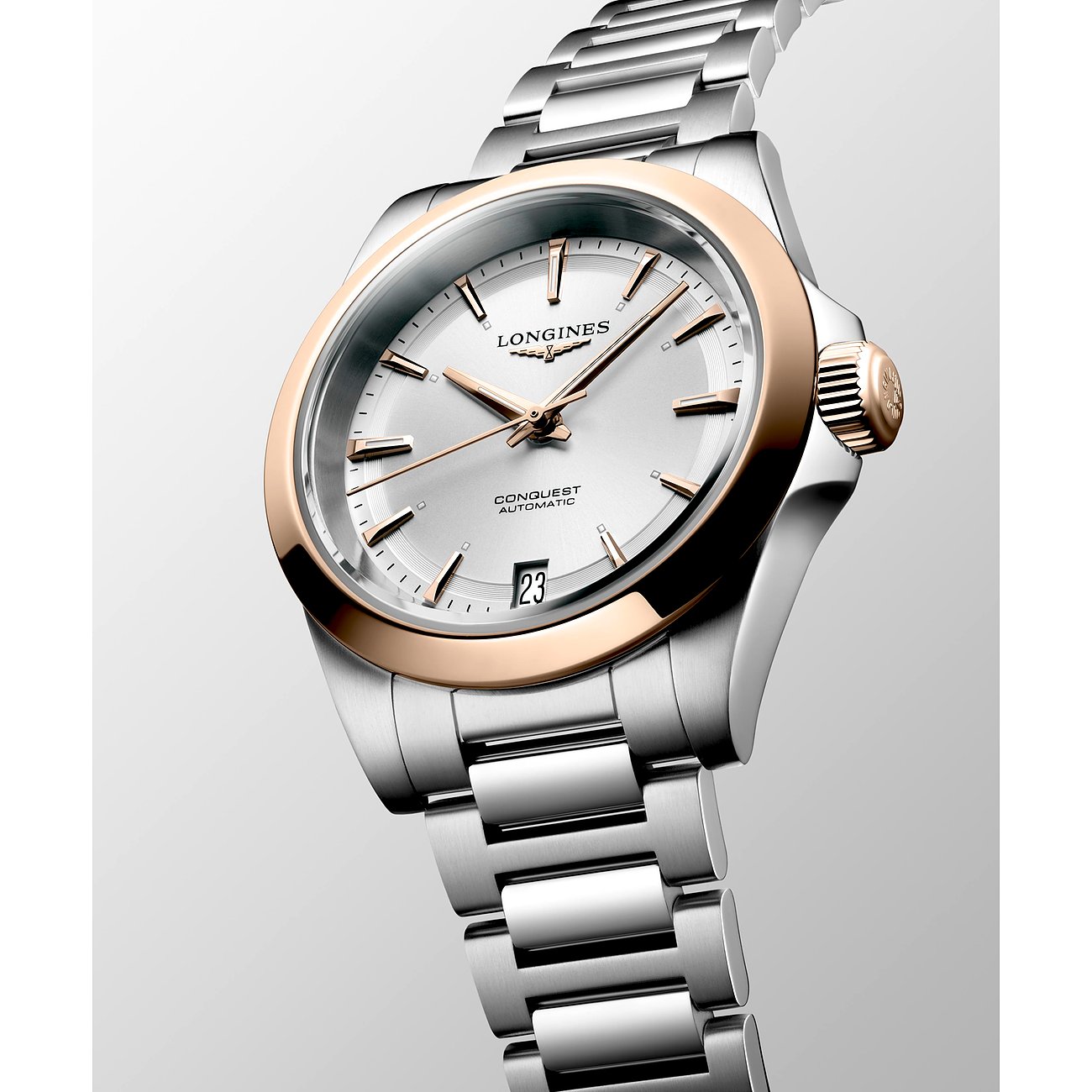 Longines Damenuhr mit Edelstahlgehäuse, Roségold-Lünette und silbernem Zifferblatt.