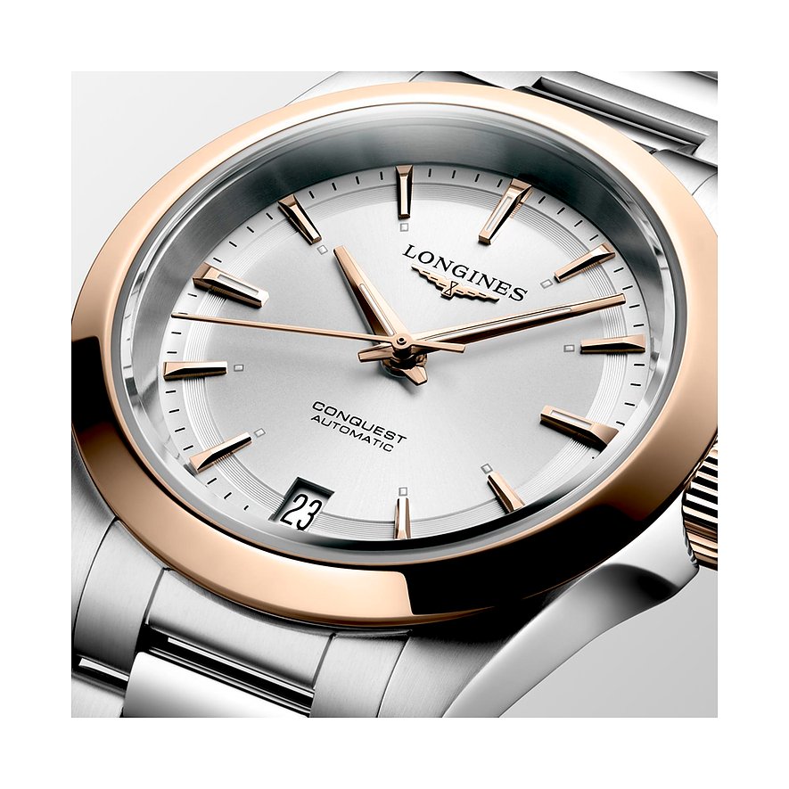 Longines Damenuhr aus Edelstahl mit Roségold-Lünette, silbernem Zifferblatt und Datum.