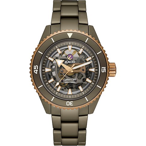 Rado Herrenuhr mit Keramikgehäuse, Skeleton-Zifferblatt und bronzefarbener Lünette.