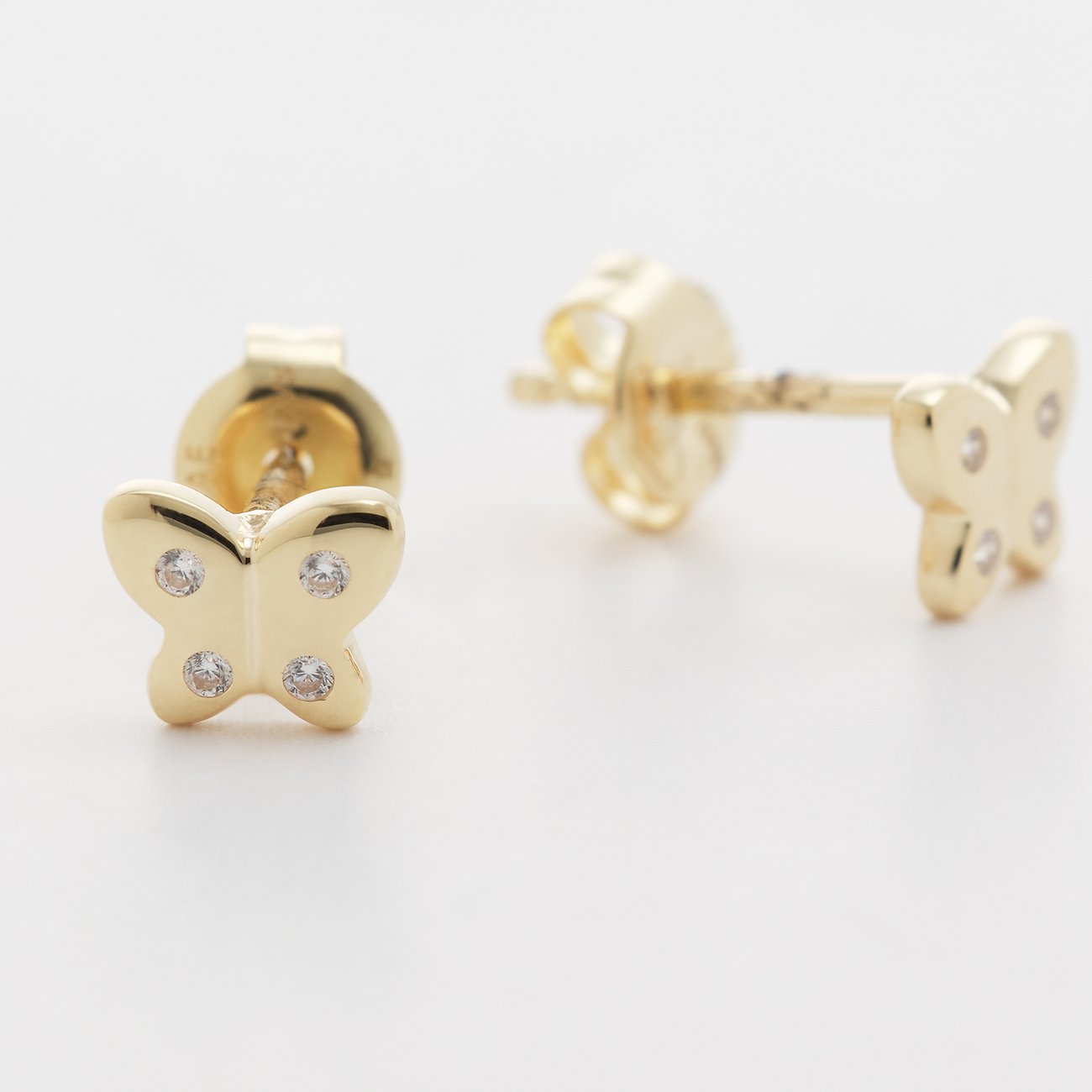 FAVS Little Friends Ohrstecker aus Gelbgold mit Schmetterlingsmotiv und Zirkonia in Schmetterlingsform.