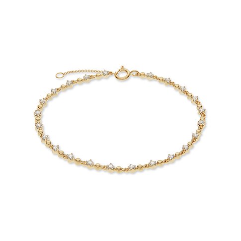 CHRIST 585er Gelbgold Armband mit abwechselnd winzigen Diamanten in Krappenfassung und runden Goldelementen.