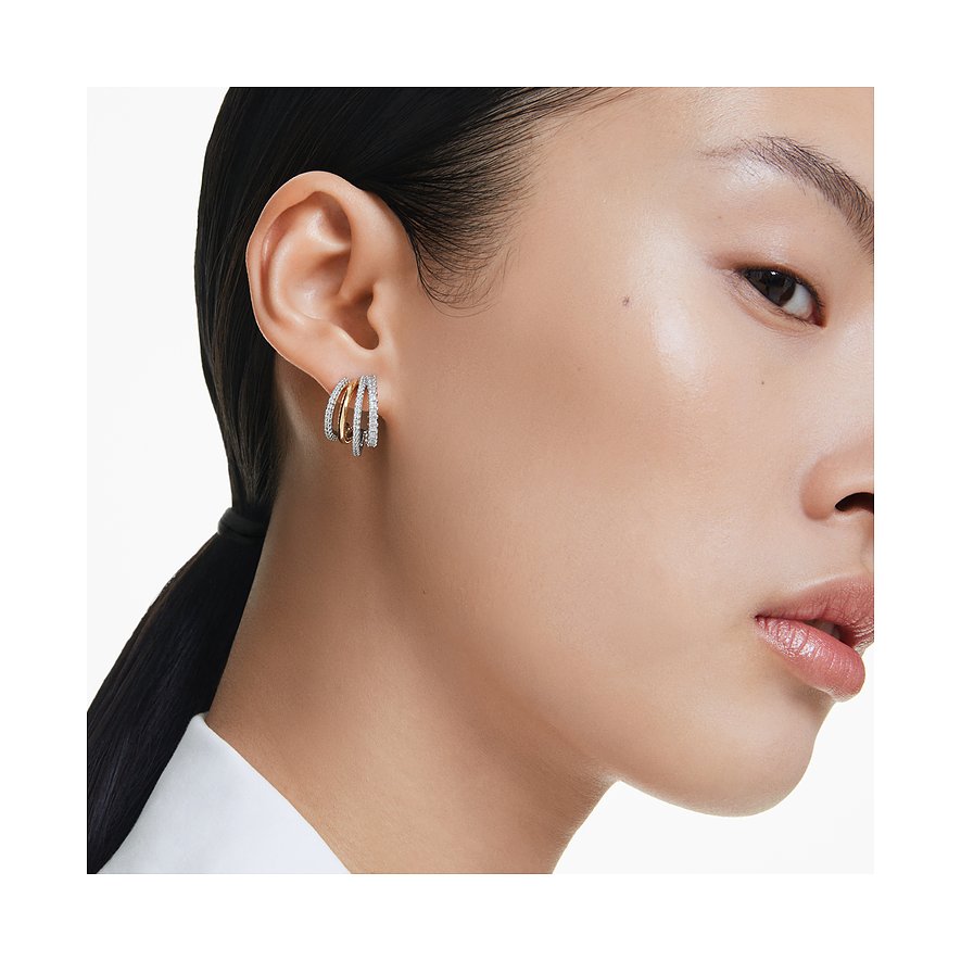 Swarovski metalen oorbellen met witte kristallen en gouden elementen.