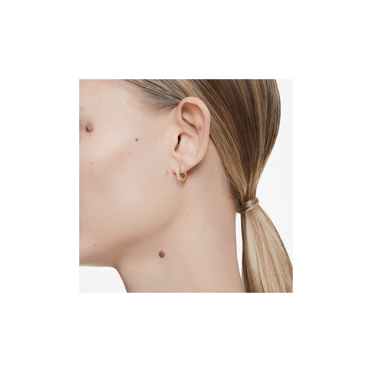 Swarovski Ohrringe aus Metall mit Kristallen, goldfarben.