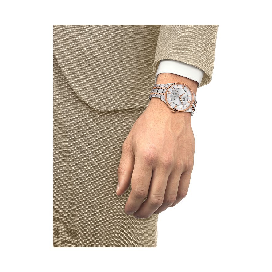 Tissot Herrenuhr mit Edelstahlgehäuse, bicolor, analog mit römischen Ziffern.