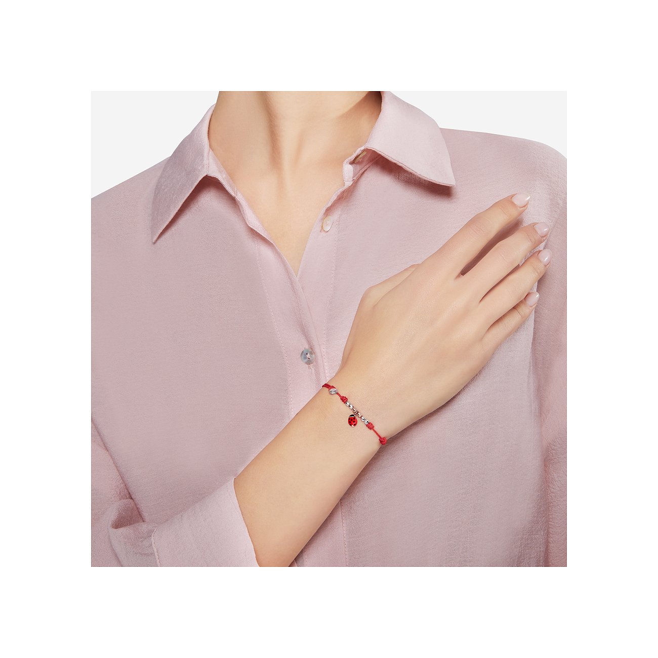 DoDo Armband aus 375 Roségold und 925 Silber mit Marienkäfer-Anhänger.