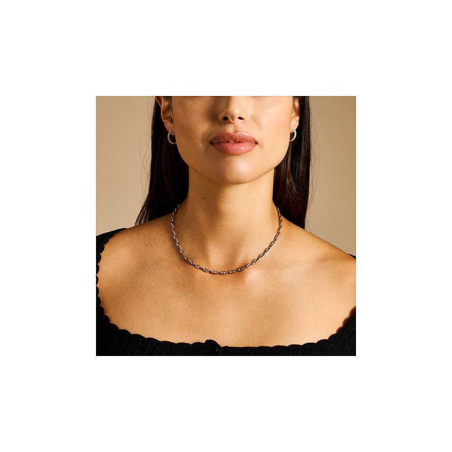 Fossil Ohrringe aus Edelstahl mit Glassteinen.