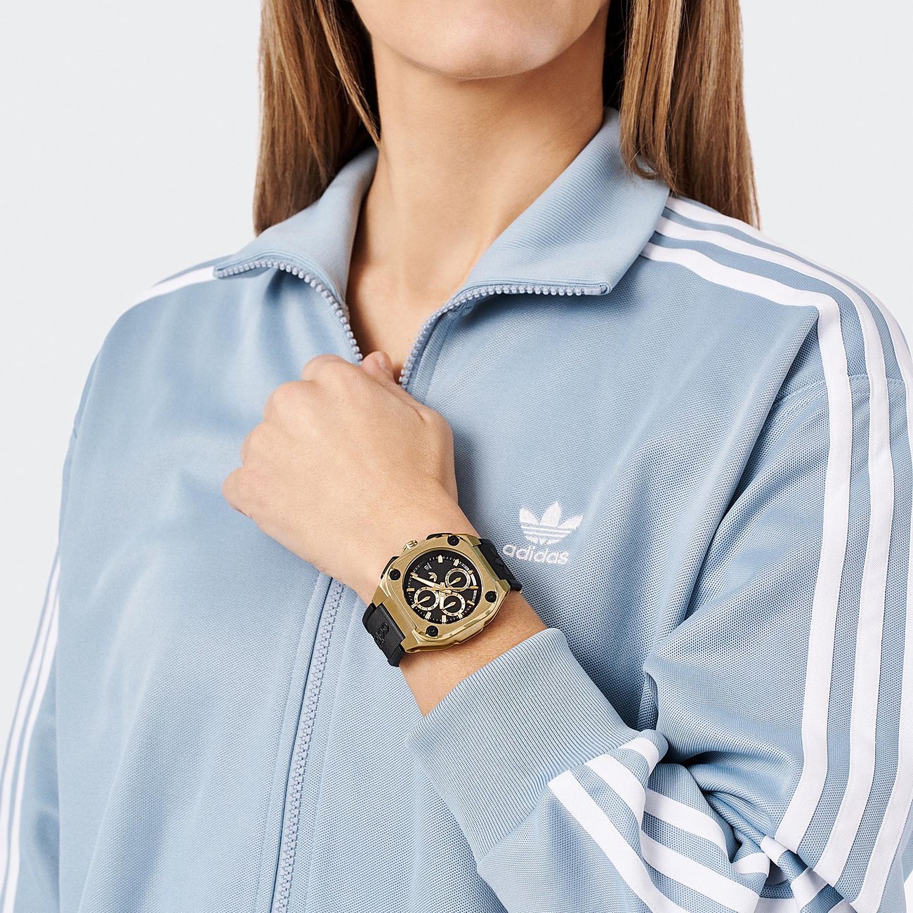 Adidas Herrenuhr mit Edelstahlgehäuse, goldfarben, analog, mit Chronograph.