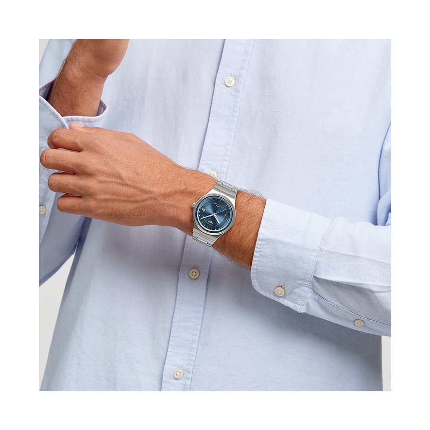 Montre unisexe Swatch avec boîtier en acier inoxydable et cadran bleu.