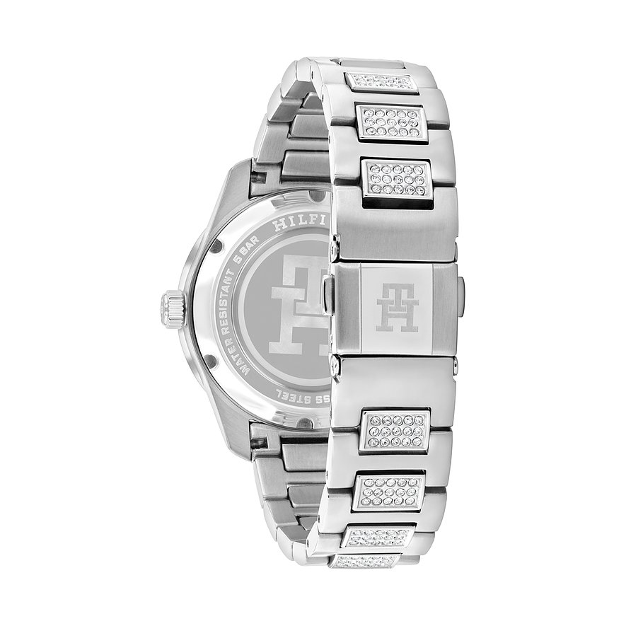 Rückseite einer Tommy Hilfiger Damenuhr aus poliertem Edelstahl mit Kristallen, silberfarbenes Armband mit Markenemblem.