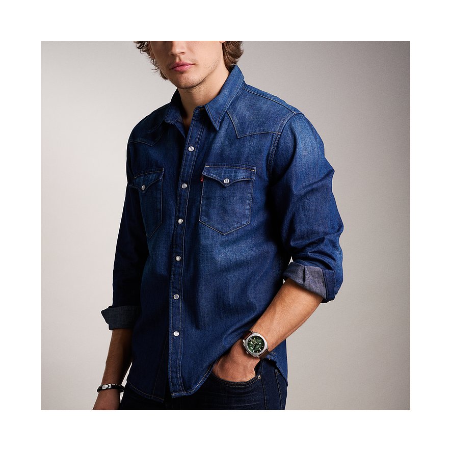 Fossil Herrenuhr mit Edelstahlgehäuse und grünem Zifferblatt.