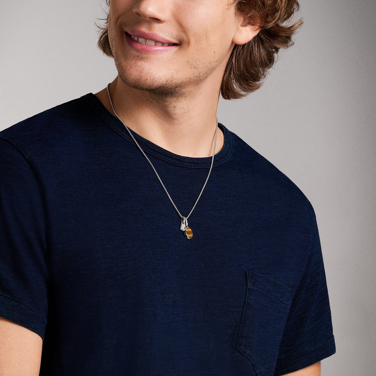 Fossil Halsschmuck aus Edelstahl mit Tigerauge.