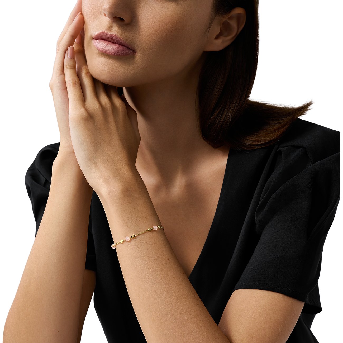 Bracelet Emporio Armani en métal avec pierres de quartz rose et éléments étoiles.