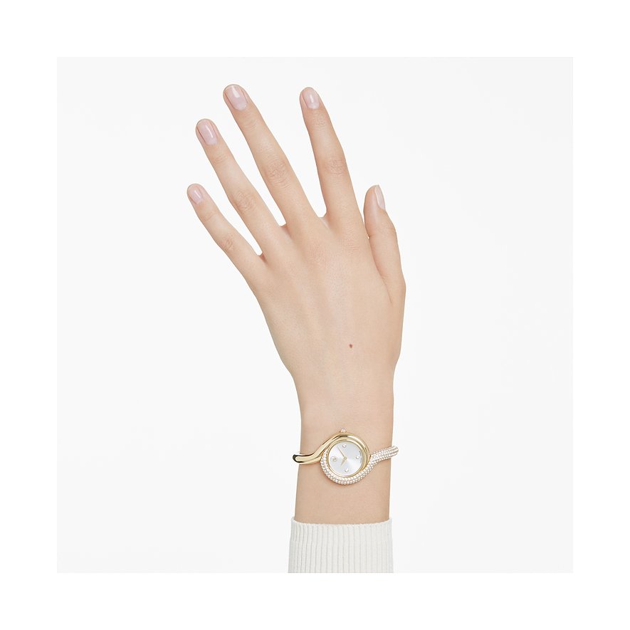 Swarovski Damenuhr mit goldfarbenem Metallgehäuse, weißem Zifferblatt und Kristallen.