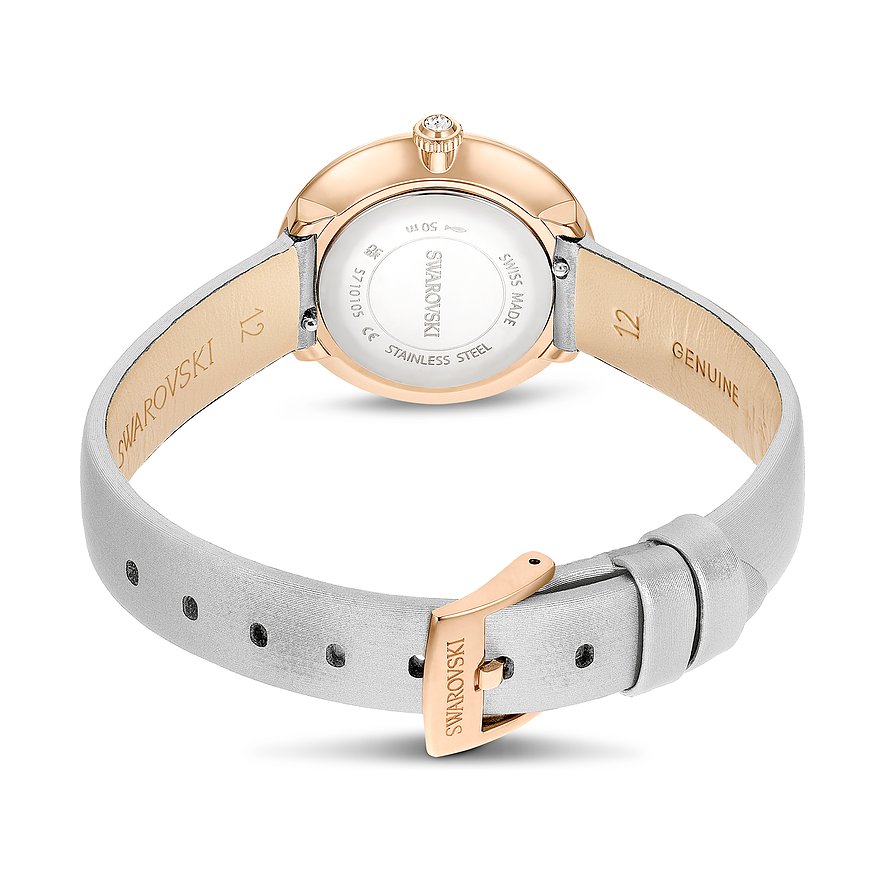 Swarovski Damenuhr mit rosévergoldetem Gehäuse, Kristallbesatz und weißem Armband.