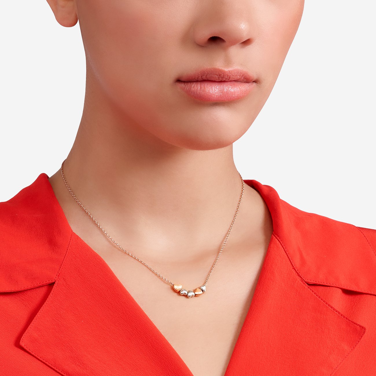 DoDo halsketting van 375 roségoud en 925 zilver met hartjes.